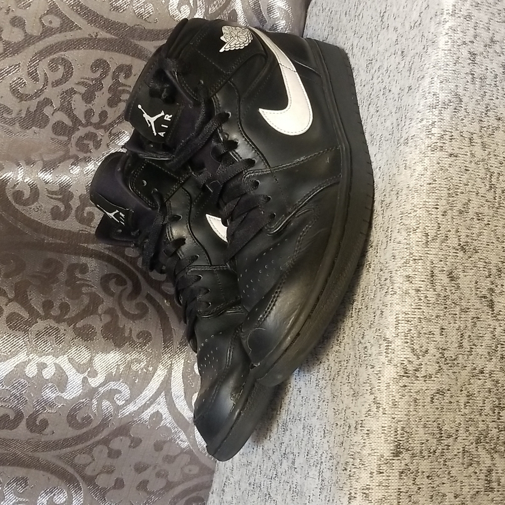 Black Air Jordans  with a nike Sign size 10 Pre Owened